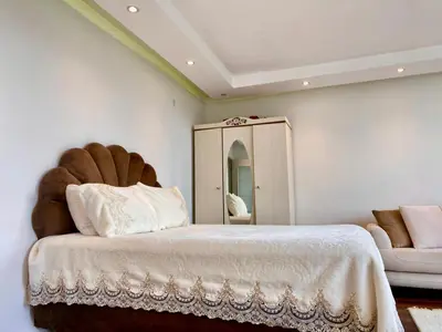 a bedroom with a large bed and a mirror at Wonderful Villa Airport 5 minutes in Arnavutköy