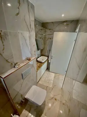 a bathroom with a toilet and a shower and a sink at Wonderful Villa Airport 5 minutes in Arnavutköy