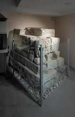 a stone wall in the corner of a room at Hotel Turkish House in Istanbul