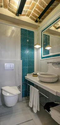 a bathroom with a tub and a toilet and a sink at Hotel Turkish House in Istanbul