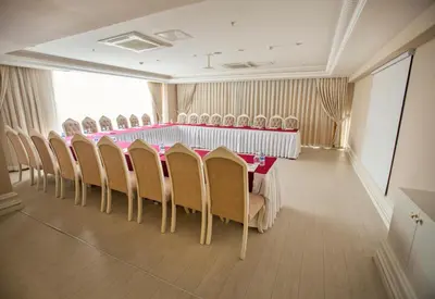 a conference room with a long table and chairs at World Point Hotel Istanbul in Istanbul