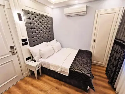 a small bedroom with a bed in a room at Luxx Garden Hotel in Istanbul