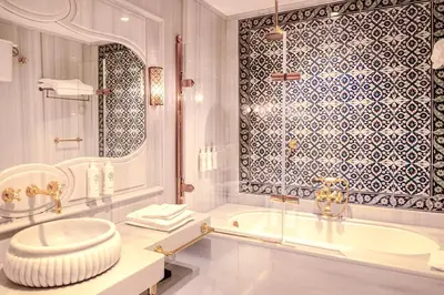 a bathroom with a tub and a sink at AJWA Sultanahmet - Preferred Hotels LVX Collection in Istanbul