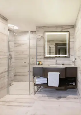 a bathroom with a sink and a mirror at Almira Hotel Thermal Spa & Convention Center in Bursa