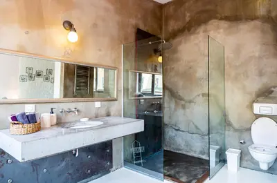 a bathroom with a toilet and a glass shower at NOA - Ali Hoca 6 in Istanbul