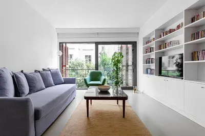 a living room with a blue couch and a table at NOA - Ali Hoca 6 in Istanbul