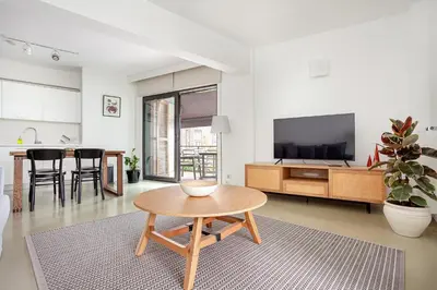 a living room with a table and a tv at NOA - Ali Hoca 6 in Istanbul
