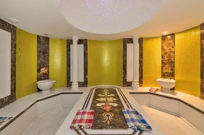 a large bathroom with yellow walls and a tub and a sink at Antea Hotel Oldcity -Special Category in Istanbul