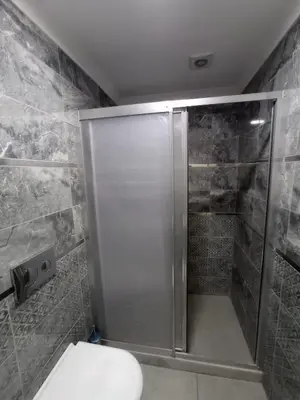 a bathroom with a shower with a toilet in it at Emin Konak Hotel in Istanbul
