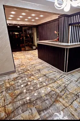 a lobby with a marble floor in a building at BALPETEK HOTEL in Istanbul