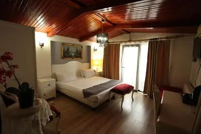 a bedroom with a bed and a window in it at Asmali Hotel in Istanbul