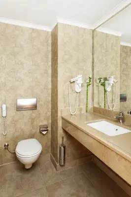 a bathroom with a toilet and a sink at WOW Istanbul Hotel in Istanbul