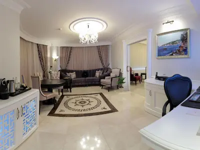 a large living room with a couch and a table at WOW Istanbul Hotel in Istanbul