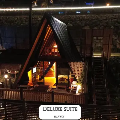 a small log cabin with a sign that says believe stuff at VADİ BUNGALOV SAPANCA in Sapanca