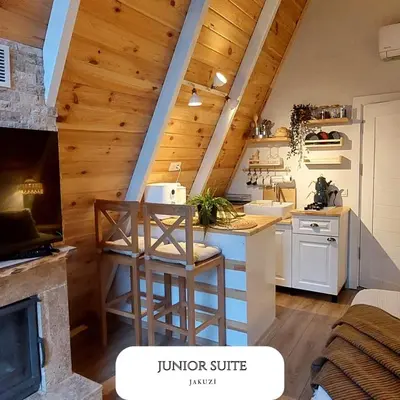 an attic kitchen with a counter and a stove at VADİ BUNGALOV SAPANCA in Sapanca