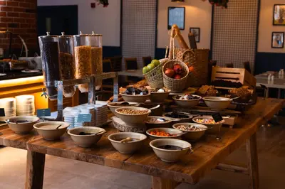 a table with bowls of food on top of it at WOW Airport Hotel in Istanbul