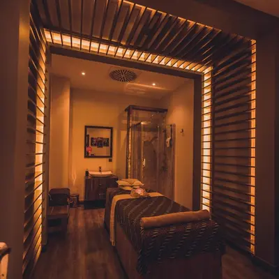 a bedroom with a bed and a bathroom with a mirror at WOW Airport Hotel in Istanbul