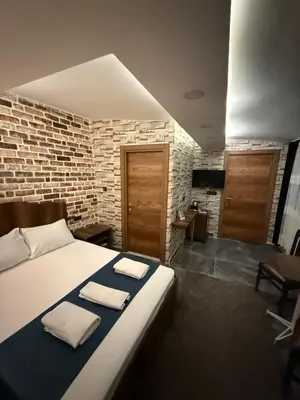 a bedroom with a bed with two towels on it at La Vien Hotel Old City in Istanbul