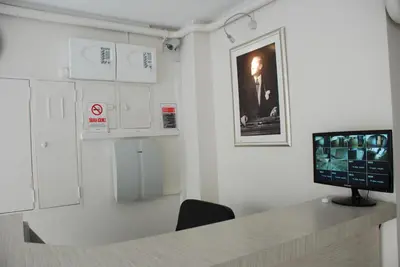 a room with a desk with a television on it at Bursa Park Apart Hotel in Bursa