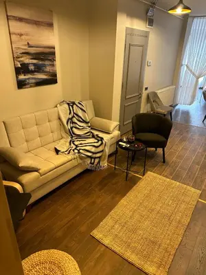 a living room with a couch and a table at Nm Suites Beyoglu in Istanbul