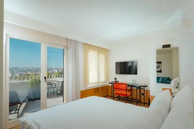 a hotel room with a bed and a balcony at The Gift Hotel in Istanbul