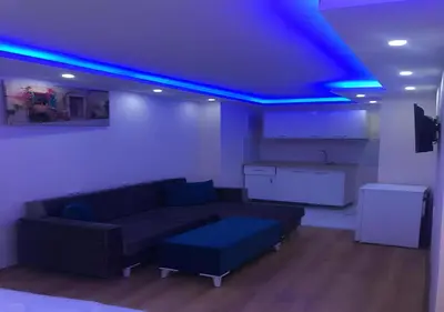 a living room with a couch and a blue ceiling at BLUE ROYAL HOTEL in Istanbul