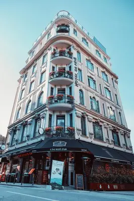 a tall white building with balconies on a street at Hotel De Reve Galata-Special Class in Istanbul