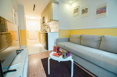 a living room with a couch and a table at Cihangir VAV Suites in Istanbul