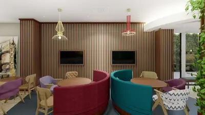 a restaurant with colorful chairs and tables in a room at Hampton By Hilton Istanbul Airport, Arnavutkoy in Istanbul
