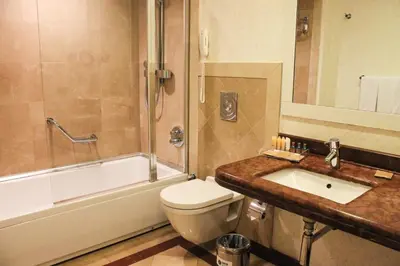 a bathroom with a toilet and a sink and a shower at Byotell Istanbul in Istanbul