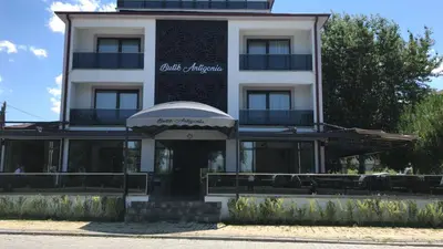 a building with a sign on the front of it at ANTİGONİA BUTİK OTEL in İznik