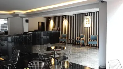 a restaurant with chairs and a table in a room at Semsan Hotel in Istanbul