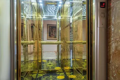 a glass door with a reflection of a room at Valide Hotel in Istanbul
