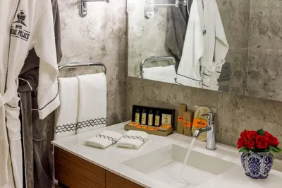 a bathroom with a sink and a mirror at Amiral Palace Hotel Boutique Class in Istanbul