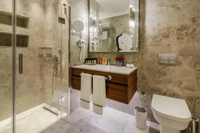 a bathroom with a shower and a toilet and a sink at Amiral Palace Hotel Boutique Class in Istanbul