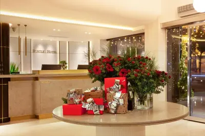 a lobby with a table with gifts and flowers at Bentley Hotel Bosphorus - Special Class in Istanbul