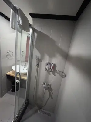 a bathroom with a shower and a sink at All Seasons Hotel in Istanbul