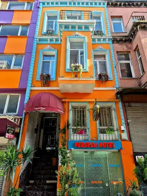 an orange building with a pizza hut sign on it at VERSECA HOTEL in Istanbul