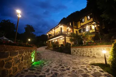 a house at night with lights on a stone path at Casa Giallo Managed By Dedeman in Sapanca
