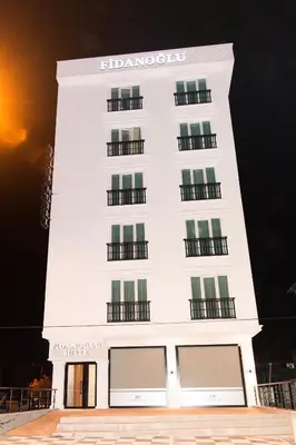 a white building with a sign on it at Fidanoğlu Suite Hotel Çorlu in Corlu