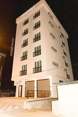 a large white building with sheep on it at Fidanoğlu Suite Hotel Çorlu in Corlu