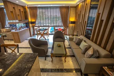 a living room with a couch and chairs and a table at Hamitbey Hotel Yenikapı in Istanbul