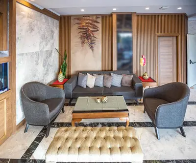 a living room with a couch and two chairs and a table at Hamitbey Hotel Yenikapı in Istanbul
