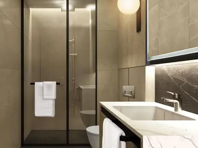 a bathroom with a sink and a toilet at Movenpick Living Istanbul Camlivadi in Istanbul