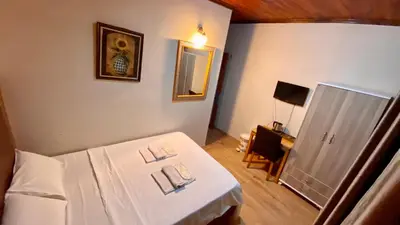 a small room with a bed and a mirror at Herton Boutique Hotel in Istanbul