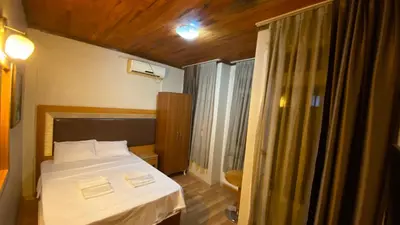 a bedroom with a white bed and a window at Herton Boutique Hotel in Istanbul