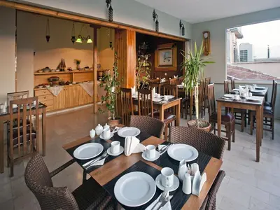 a dining room with a table and chairs at Hotel Erguvan - Special Category in Istanbul