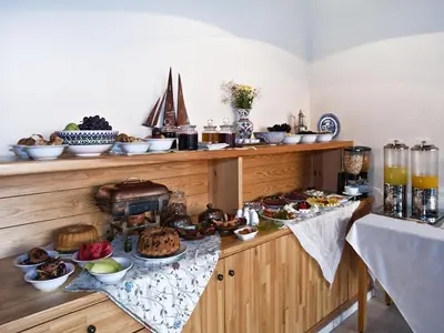 a kitchen with a buffet of food on a counter at Hotel Erguvan - Special Category in Istanbul