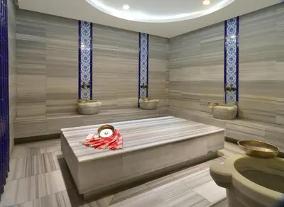 a room with a tub with a person sitting in it at Pera Tulip Hotel & Spa in Istanbul