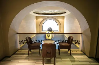 a dining room with a table and chairs and a window at Pera Tulip Hotel & Spa in Istanbul